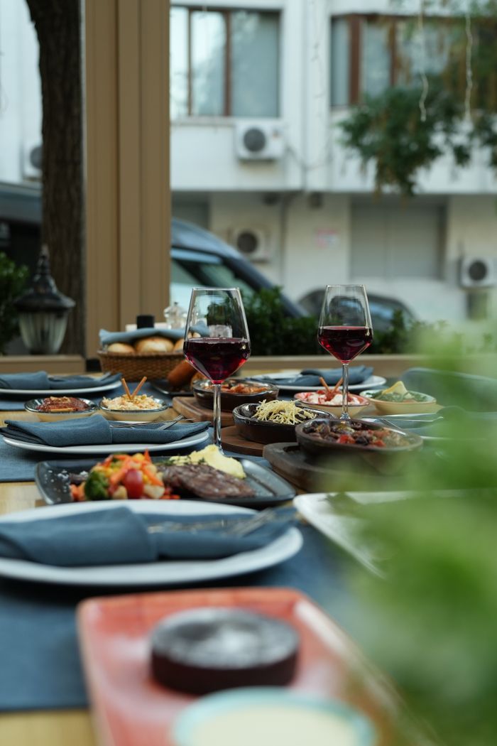 A vibrant outdoor dining scene featuring wine and assorted tapas, perfect for a relaxed gathering.
