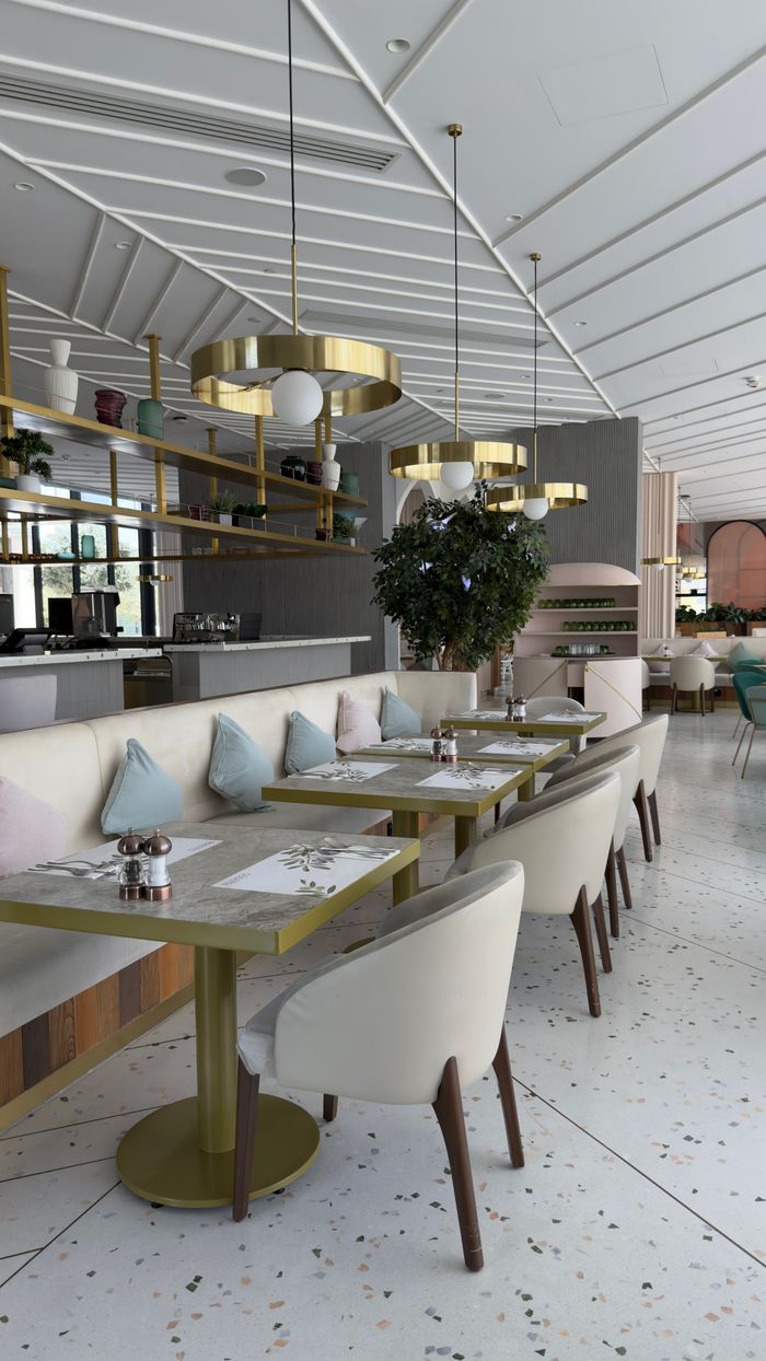 Stylish restaurant interior with elegant decor, seating, and ambient lighting.